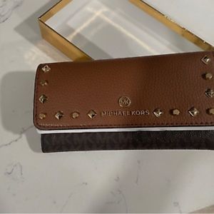 Michael Kors wallet. New in box- never been used, brown leather